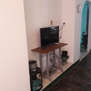 a television sitting on a table in a room at casa lucy in Puerto Iguazú