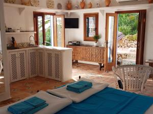 a kitchen with a table with towels on top of it at Can Xica in Sant Josep de sa Talaia