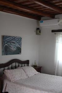 Postel nebo postele na pokoji v ubytování Pura Felicidad - Casa de viajeros