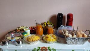 a table with many different types of food on it at Pousada Mont Hebrom in Ibicoara