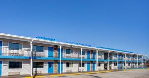 an apartment building with blue and white at Motel 6 Branson, Mo in Branson