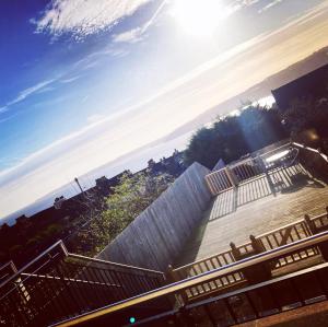 a view of a stairs with the sun in the sky at Seabourne Scarborough Beautiful 2 bedroom 2 bathrooom Penthouse With Fabulous Seaview in Scarborough