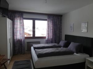 Postel nebo postele na pokoji v ubytování Haus Barbara
