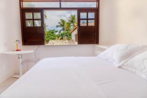 Кровать или кровати в номере IP01 Casa 5 Suítes a 100m da Praia Pedra do Sal