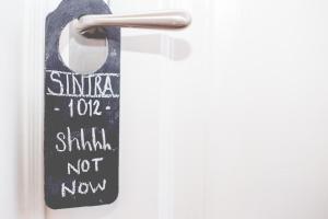a door handle with a sign on it at Sintra1012 Boutique Guesthouse in Sintra