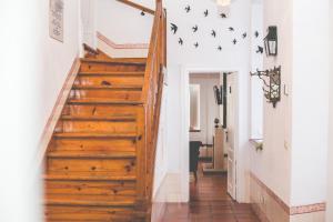 a staircase in a home with wooden steps at Sintra1012 Boutique Guesthouse in Sintra