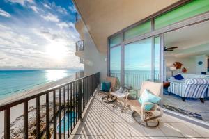 a balcony with a view of the ocean at Phoenix West in Orange Beach