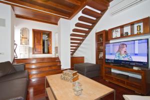 a living room with a large flat screen tv at Casa Rural Hero in Tías