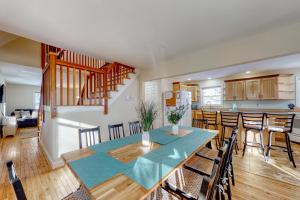 a dining room and kitchen with a table and chairs at 15 Chocorua View Drive in Madison