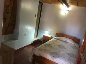Postel nebo postele na pokoji v ubytování Hostal Puritama