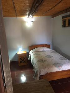 Postel nebo postele na pokoji v ubytování Hostal Puritama