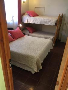Postel nebo postele na pokoji v ubytování Hostal Puritama