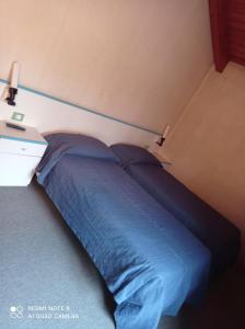 Ein Bett oder Betten in einem Zimmer der Unterkunft Locanda Alla Stazione