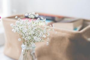 a vase filled with white flowers on a table at Sintra1012 Boutique Guesthouse in Sintra