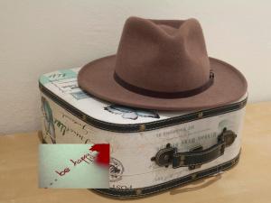 a hat is sitting on top of two suitcases at Spot Smart Nomad in Barcelona