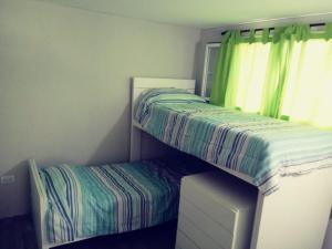 מיטה או מיטות בחדר ב-Cabaña Buccia