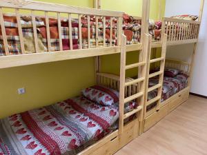 two bunk beds with pillows in a room at Хостел Мажор in Kharkiv +16 photos