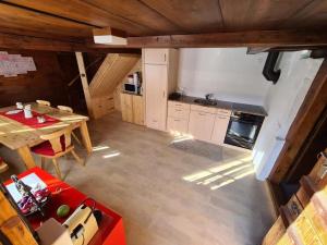 an overhead view of a kitchen with a table at Wettermatte in Kiental