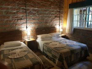 En eller flere senge i et værelse på Villa Italia hospedagem + 157 billeder