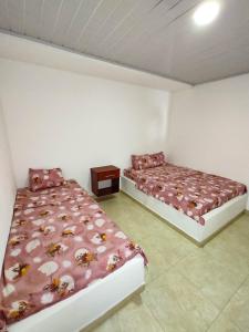 Postel nebo postele na pokoji v ubytování Hotel Central Fusa