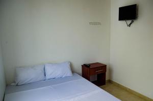 Postel nebo postele na pokoji v ubytování Hotel Central Fusa