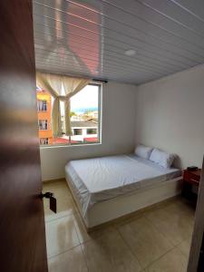 Postel nebo postele na pokoji v ubytování Hotel Central Fusa