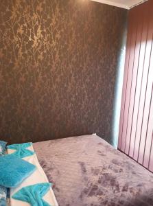 Łóżko lub łóżka w pokoju w obiekcie Apartman Ruzmići Divčibare