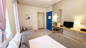 Llit o llits en una habitació de DW Design Residence
