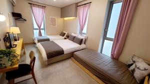 Llit o llits en una habitació de DW Design Residence