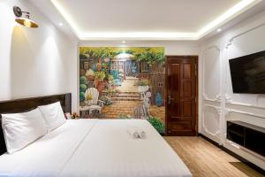 Postel nebo postele na pokoji v ubytování Lotus Laverne Hotel