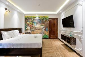 TV a/nebo společenská místnost v ubytování Lotus Laverne Hotel