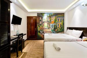 Postel nebo postele na pokoji v ubytování Lotus Laverne Hotel