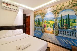 Postel nebo postele na pokoji v ubytování Lotus Laverne Hotel