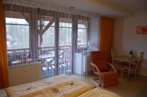 Postel nebo postele na pokoji v ubytování Apartments Hážovský Dvůr