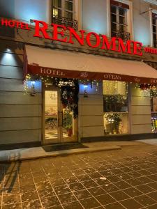 a store front of a hotel with a red neon sign at Renomme hotel by Original Hotels in Yekaterinburg