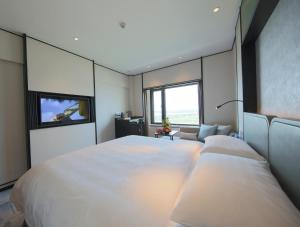 Postel nebo postele na pokoji v ubytování Shangri-La Harbin + 37 fotografií