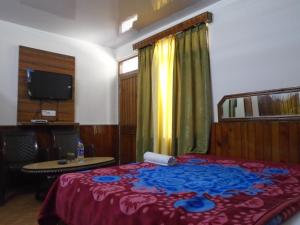 Letto o letti in una camera di Hotel Magnolia Mallroad Manali