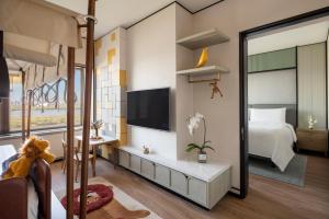 Postel nebo postele na pokoji v ubytování Shangri-La Harbin