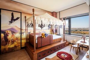Postel nebo postele na pokoji v ubytování Shangri-La Harbin