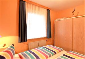 En eller flere senge i et værelse på Charming Apartment in Westerland-Sylt, 35 m², garden