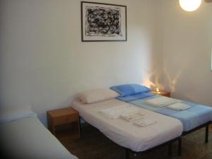 A bed or beds in a room at Cozy House, Santa Maria del Focallo, Fireplace