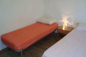 A bed or beds in a room at Cozy House, Santa Maria del Focallo, Fireplace
