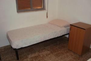 A bed or beds in a room at Cozy House, Santa Maria del Focallo, Fireplace