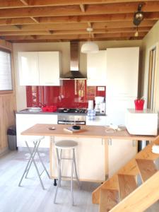 a kitchen with a large wooden table in a room at Maison de 2 chambres avec vue sur la ville jardin clos et wifi a Dainville in Dainville
