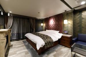 Postel nebo postele na pokoji v ubytování ホテルバースデーきよす店 HOTEL Birthday kiyosu