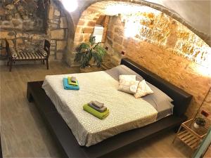 Postel nebo postele na pokoji v ubytování B&B Le Statuine
