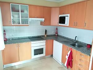 Kuchyň nebo kuchyňský kout v ubytování Bright Apartment Mogán + Pool