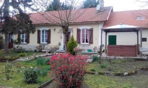 a white house with a red roof at Maison accueillante à Gabarret, jacuzzi et jardin in Gabarret +8 photos
