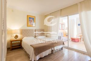 Postel nebo postele na pokoji v ubytování Hacienda Playa