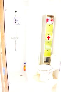 a bathroom with a toilet and a medicine cabinet at Cozy apartment in Dénia, 40 m² with shared pool in Denia